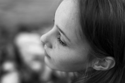 Close-up portrait of woman looking away