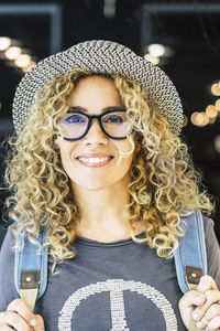 Portrait of young woman wearing sunglasses