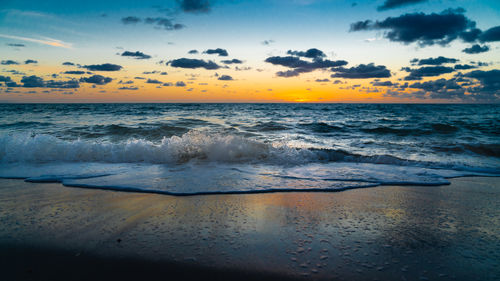 Scenic view of sea against sky during sunset