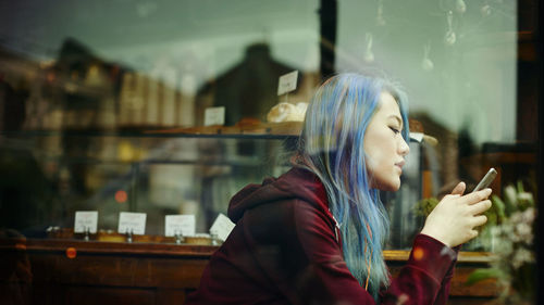 Young woman using mobile phone