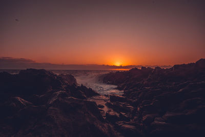 Scenic view of sea against sky during sunset