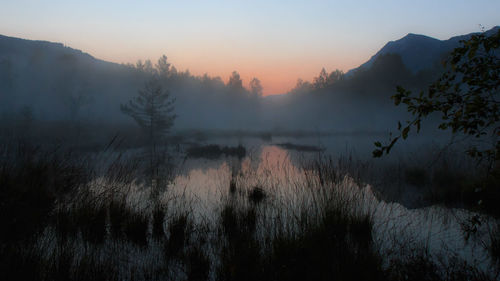 Scenic view of landscape against sky during sunset