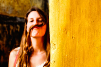 Portrait of a smiling young woman looking away