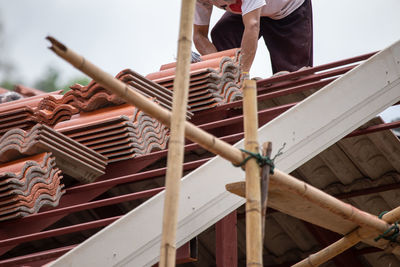 Low section of man working at construction site