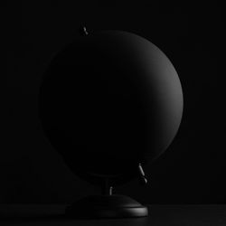 Close-up of electric lamp against black background