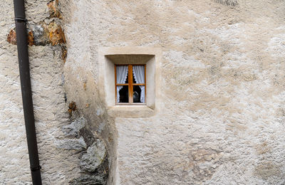 Low angle view of window on old building