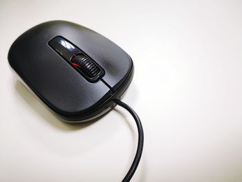 Close-up of laptop on table against white background
