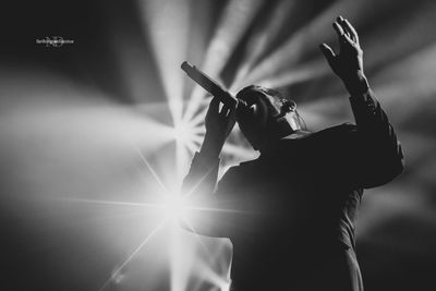 Silhouette of person playing at music concert