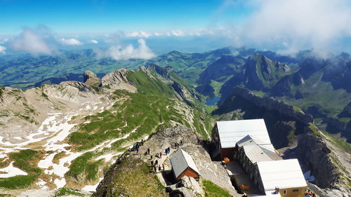 Panoramic view of houses and mountains against sky