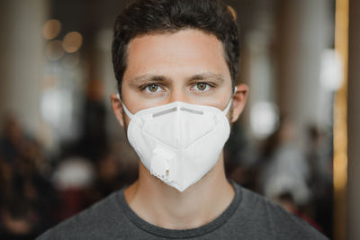 Close-up portrait of man wearing mask