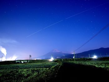 Scenic view of landscape against sky at night