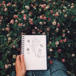 Close-up of hand with flowers