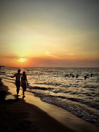 Scenic view of sea at sunset