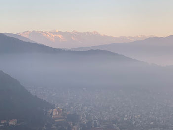 Scenic view of mountains against sky during sunset