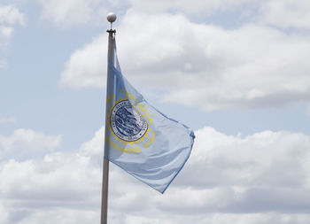 Low angle view of flag against sky