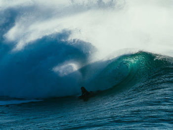 Woman surfing on sea