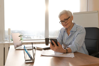 Female doctor working in office