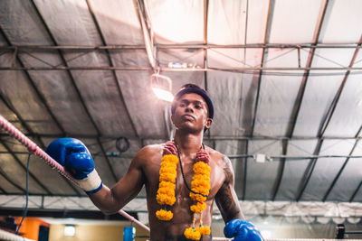 Low angle view of boxer wearing garland in ring