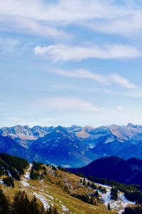 Scenic view of snowcapped mountains against sky