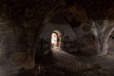 View of historical building through cave