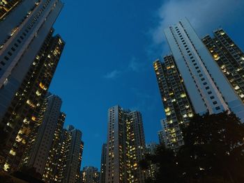 Skyscrapers in city against sky