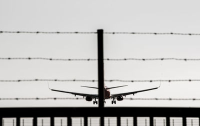 Airplane flying against clear sky