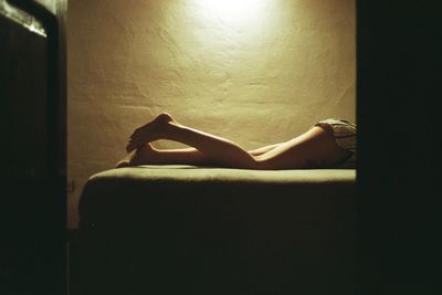 Young woman sitting on floor