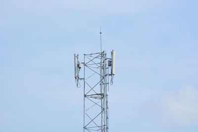 Low angle view of communications tower against sky