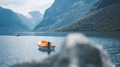 Scenic view of lake by snowcapped mountains