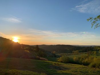 Scenic view of landscape against sky during sunset