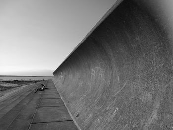 Man on road against sky