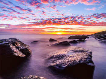 Scenic view of sea against sky during sunset