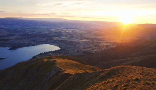 Scenic view of mountains against sky during sunset