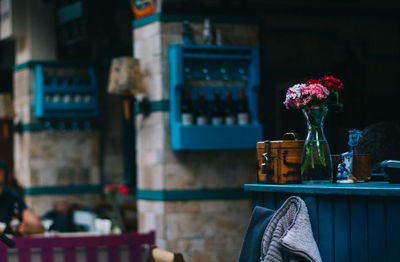 Flower vase on table at restaurant