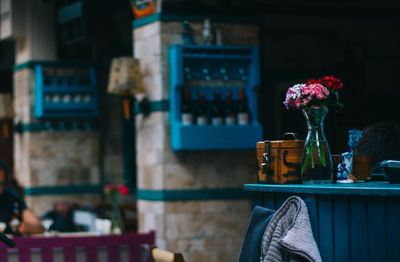 Flower vase on table at restaurant