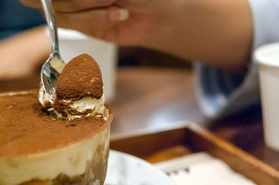 Close-up of hand holding ice cream