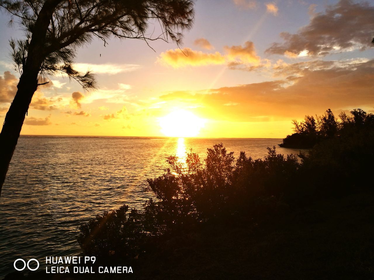 SCENIC VIEW OF SUNSET OVER SEA