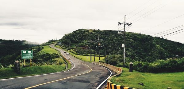 Road on mountain against sky