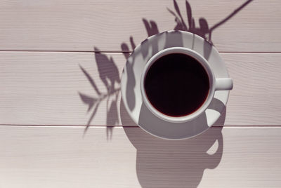 High angle view of coffee cup on table