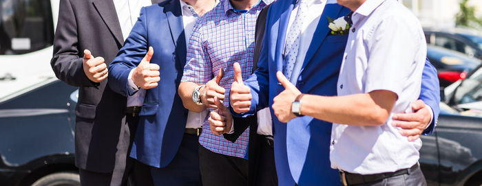 Business people stacking hands