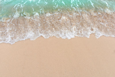 High angle view of surf on beach