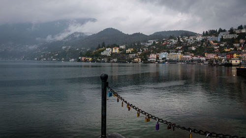 Scenic view of sea against sky in city