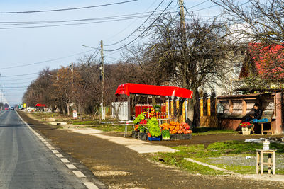 Road by building against sky in city