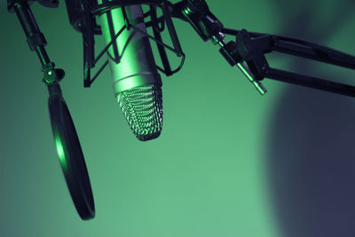 Close-up of microphone against blue background