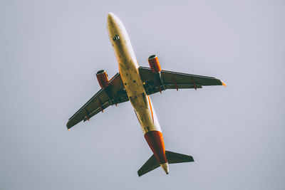 Low angle view of airplane against sky