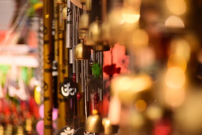 Close-up of wind chimes for sale in store