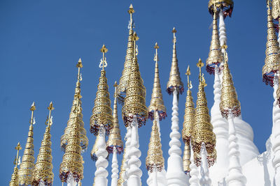 Low angle view of temple against clear blue sky