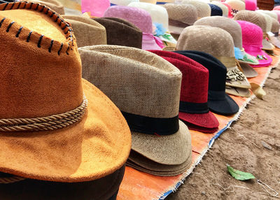 Close-up of hats for sale in market
