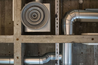 Close-up of pipeline and machinery at factory