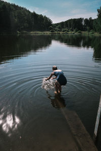 Man surfing in lake